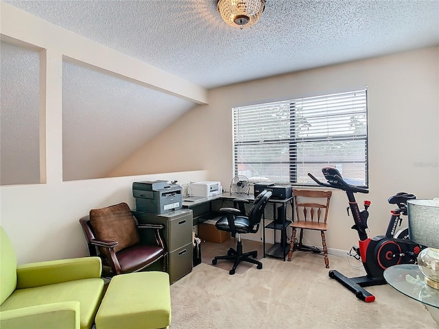 office area featuring lofted ceiling with beams, light carpet, and a textured ceiling