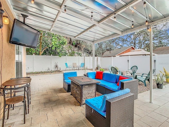 view of patio / terrace featuring an outdoor living space with a fire pit