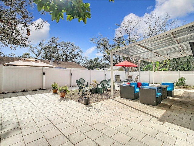 view of patio / terrace with an outdoor living space with a fire pit