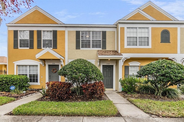 townhome / multi-family property with stucco siding