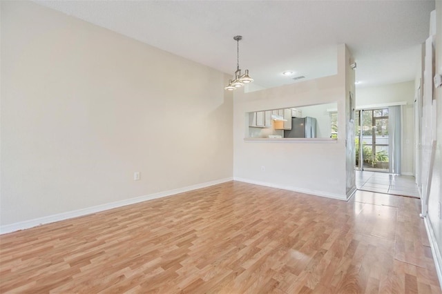 unfurnished living room featuring light hardwood / wood-style flooring