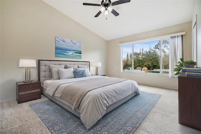 bedroom featuring vaulted ceiling, light carpet, and ceiling fan