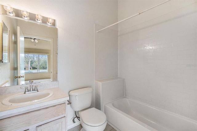 full bathroom featuring vanity, bathtub / shower combination, and toilet