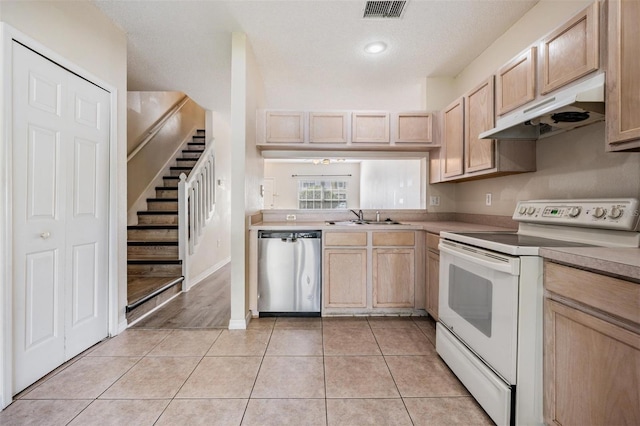 kitchen with light brown cabinetry, electric range, visible vents, dishwasher, and under cabinet range hood