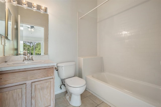 bathroom with tile patterned floors, vanity, bathtub / shower combination, ceiling fan, and toilet