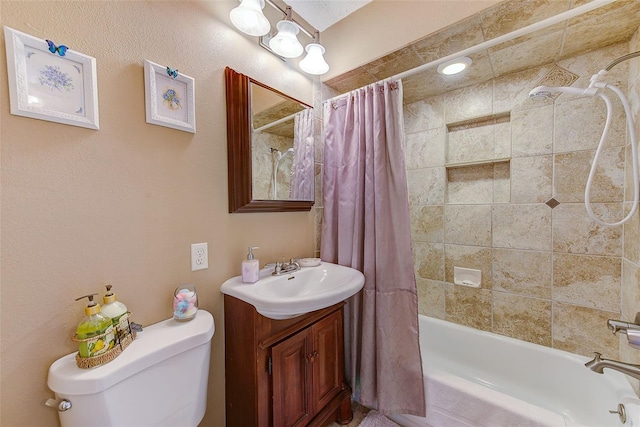 full bathroom featuring vanity, shower / bath combo with shower curtain, and toilet