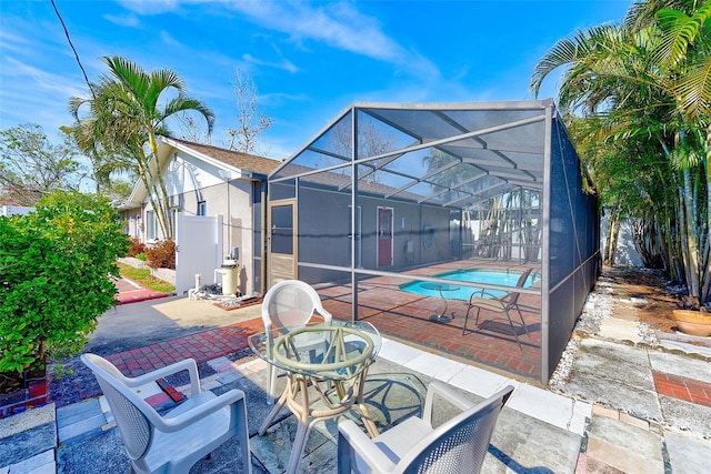 view of patio / terrace with glass enclosure