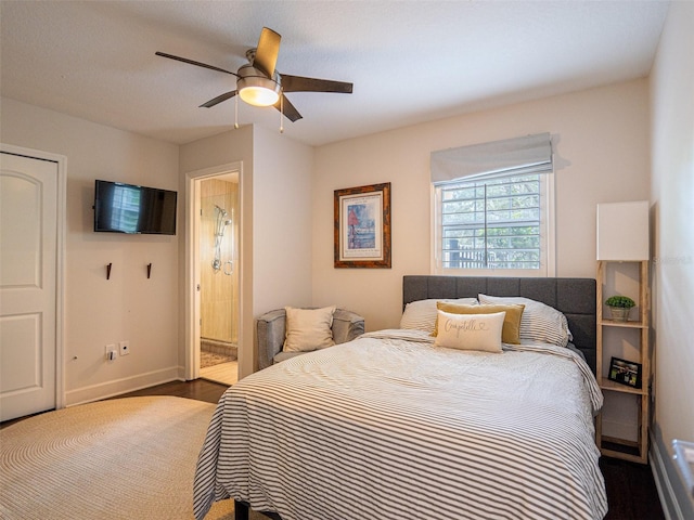 bedroom featuring ensuite bathroom, hardwood / wood-style floors, and ceiling fan