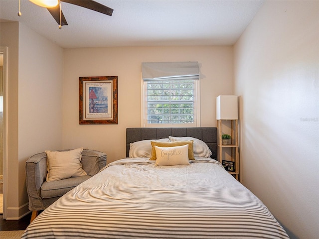 bedroom with wood-type flooring and ceiling fan