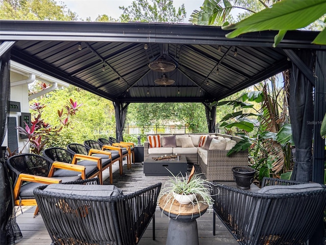 deck featuring a gazebo and an outdoor hangout area