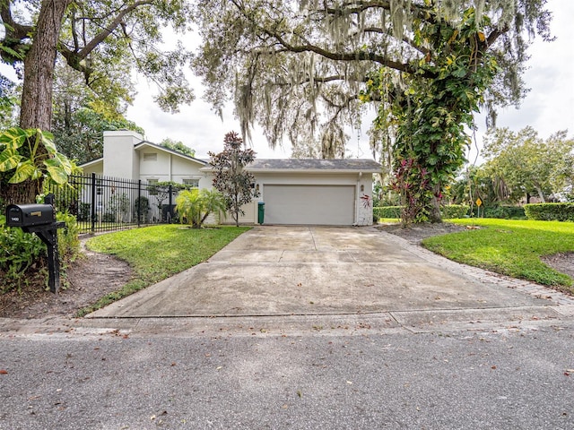 ranch-style home featuring a garage and a front yard