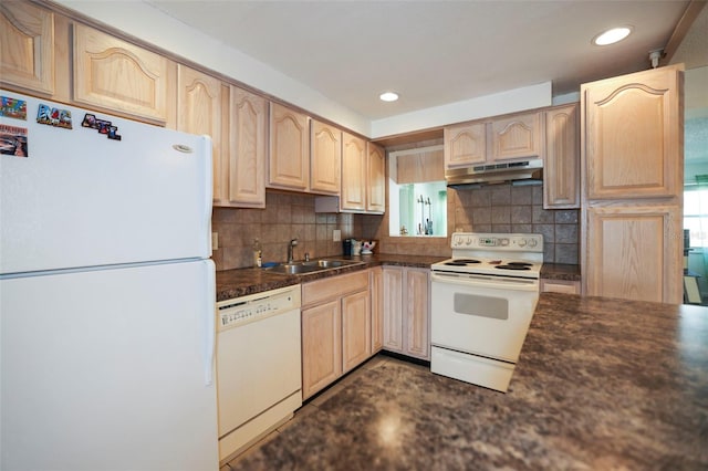 kitchen with tasteful backsplash, sink, white appliances, and a wealth of natural light