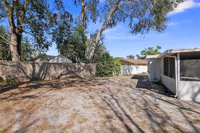 view of yard featuring a sunroom