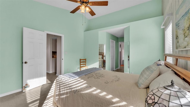 carpeted bedroom featuring baseboards