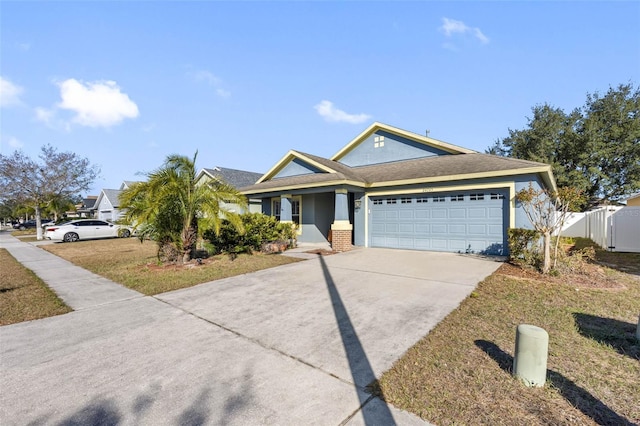 view of front of property featuring a garage and a front lawn