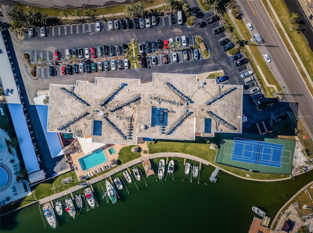 birds eye view of property with a water view