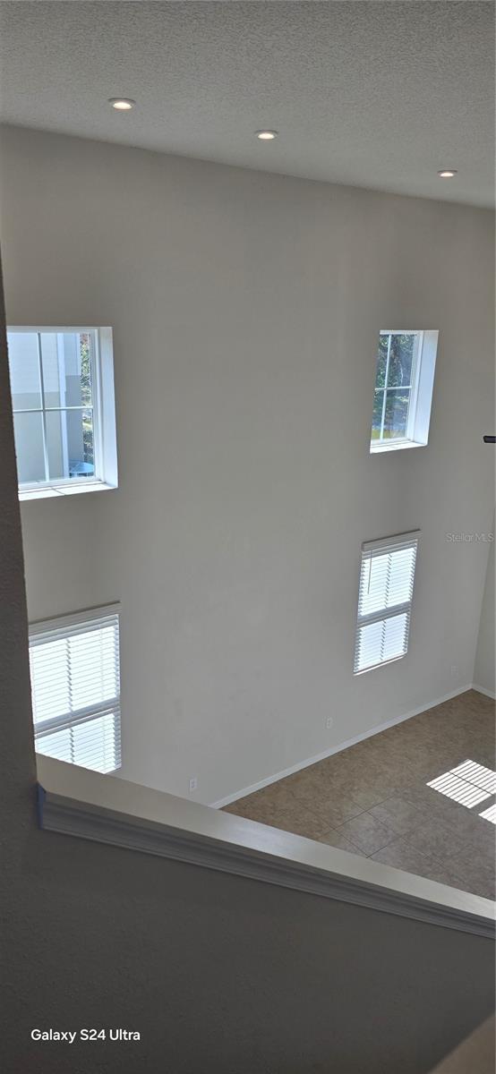 empty room featuring a textured ceiling