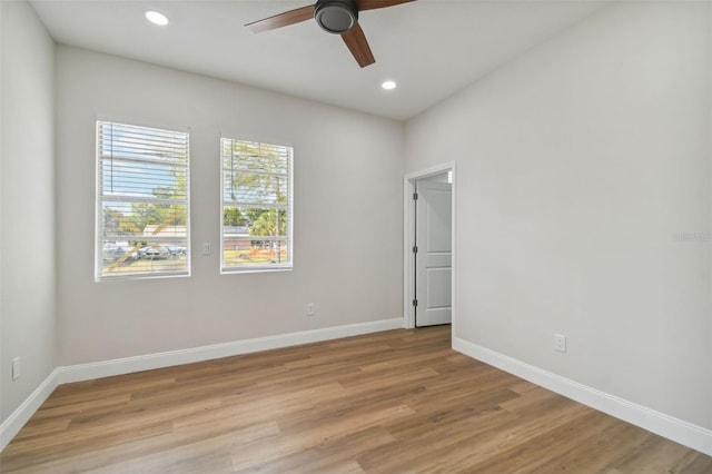 unfurnished room featuring ceiling fan and light wood-type flooring