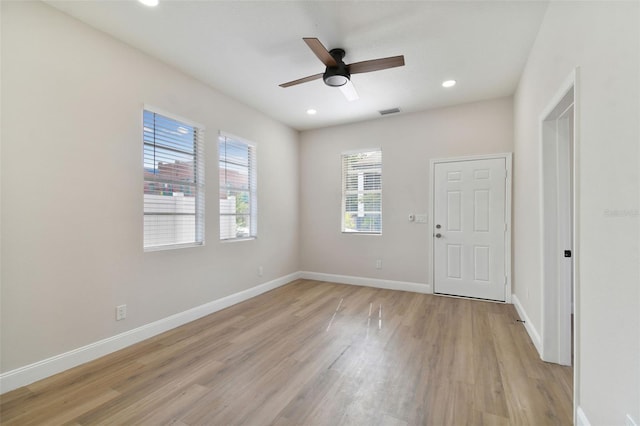 unfurnished room with ceiling fan and light hardwood / wood-style floors