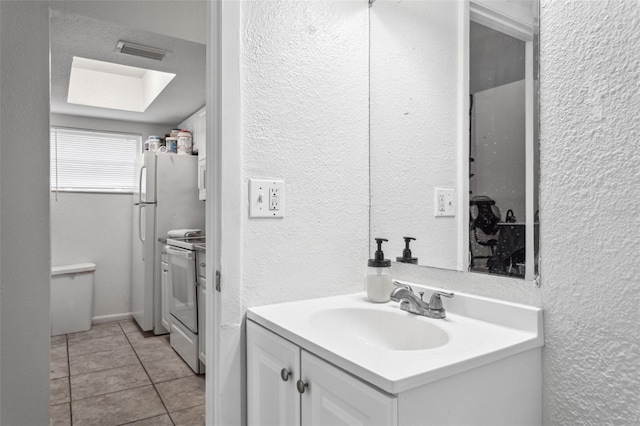 bathroom featuring tile patterned floors and vanity