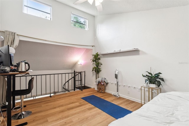 bedroom with wood-type flooring and lofted ceiling