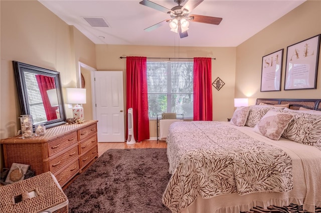 bedroom featuring light hardwood / wood-style flooring and ceiling fan