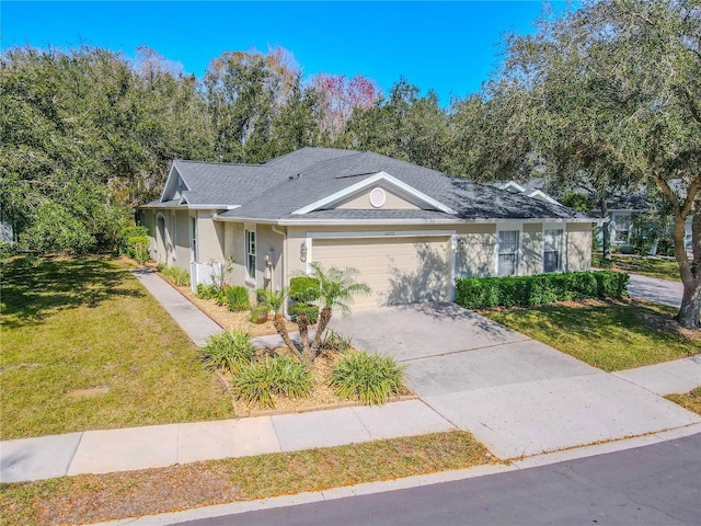 single story home featuring a garage and a front lawn