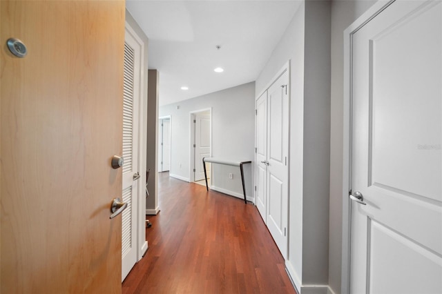 hallway with dark hardwood / wood-style flooring