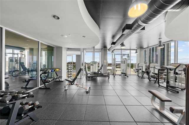 gym with a wall of windows and a healthy amount of sunlight