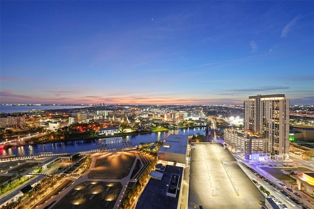 aerial view at dusk with a water view