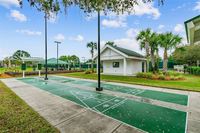 view of property's community with a gazebo and a yard