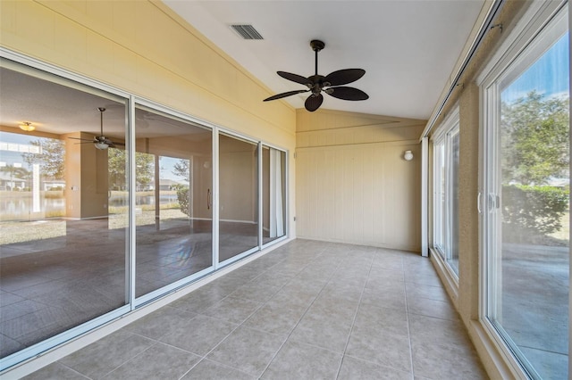 unfurnished sunroom with lofted ceiling and ceiling fan