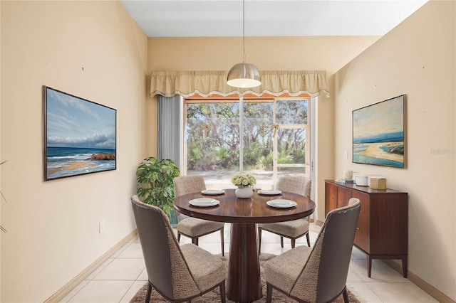 dining area with baseboards and light tile patterned floors