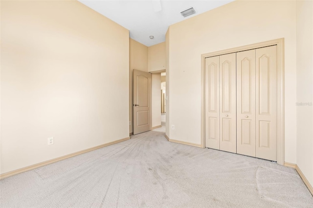 unfurnished bedroom with visible vents, baseboards, ceiling fan, carpet, and a closet