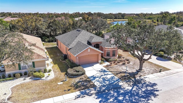 birds eye view of property with a water view