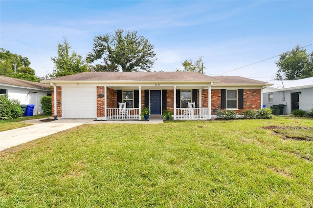 ranch-style house with a garage, covered porch, and a front yard