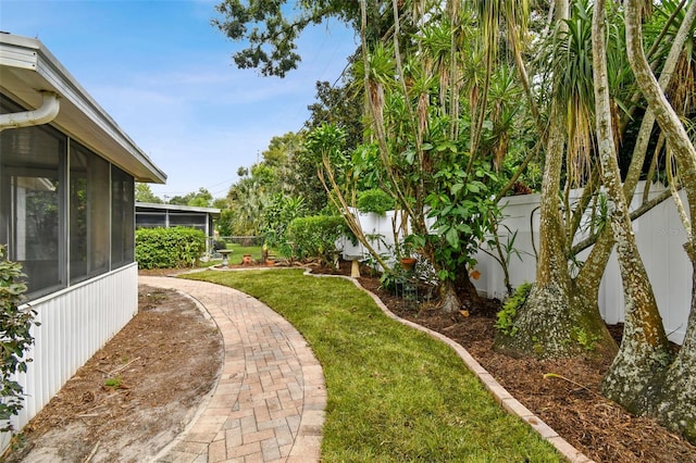 view of yard with a sunroom