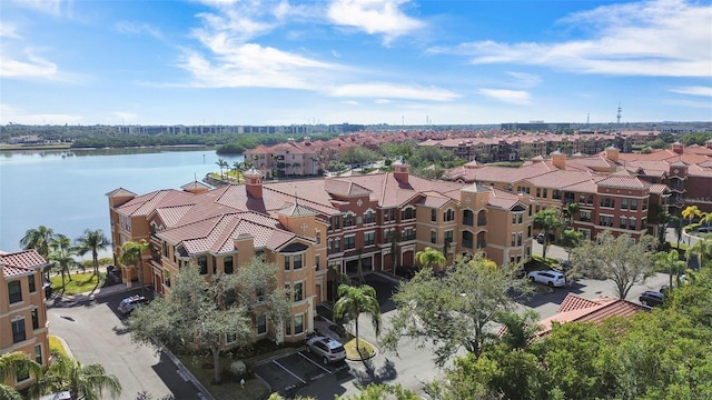 birds eye view of property with a water view