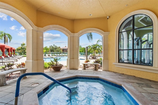 view of pool featuring a community hot tub