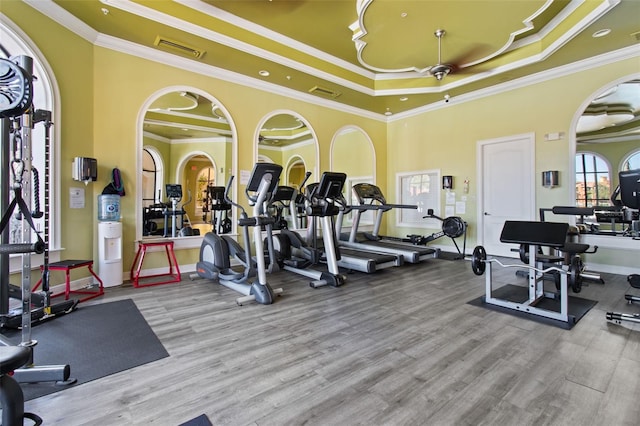 gym with visible vents and crown molding