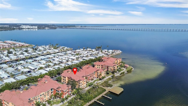 drone / aerial view with a water view and a residential view