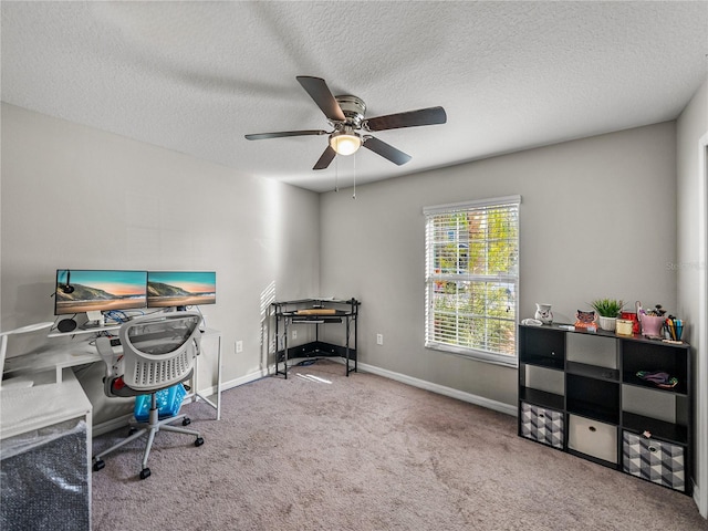 office with ceiling fan, light colored carpet, and a textured ceiling