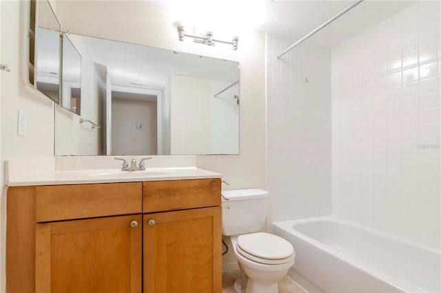 full bathroom with vanity, toilet, and tiled shower / bath combo