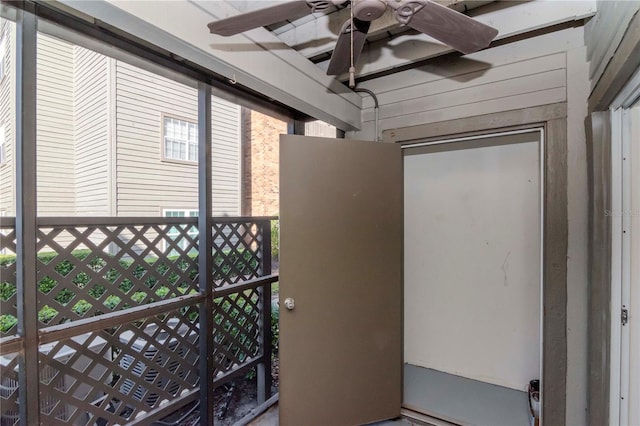 entrance to property with ceiling fan