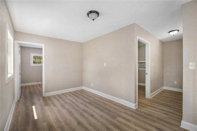 unfurnished room featuring wood-type flooring