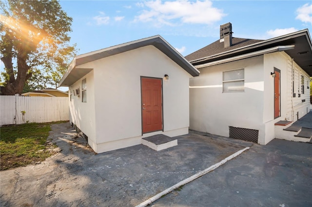 back of property with a patio