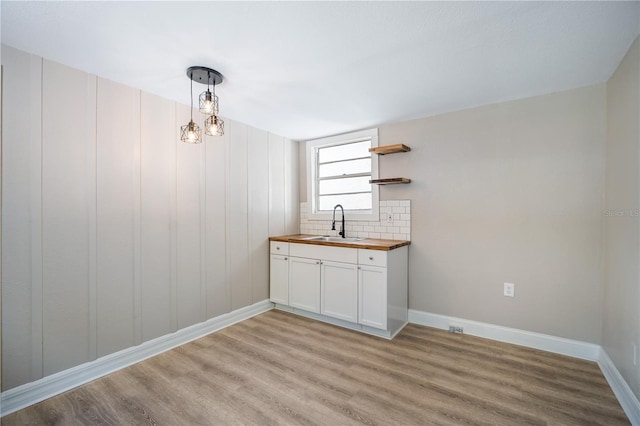 interior space with sink and light hardwood / wood-style flooring