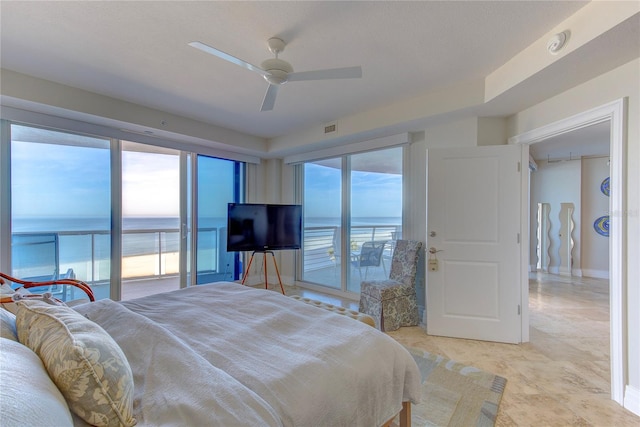 bedroom with multiple windows, access to exterior, and ceiling fan