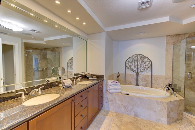 bathroom featuring vanity and plus walk in shower