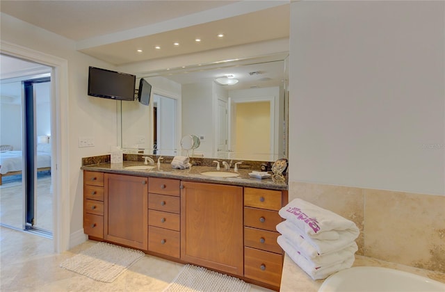 bathroom with vanity and tile patterned flooring